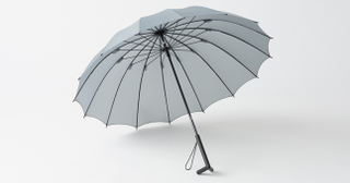 Illustration for article titled A Clever Standing Umbrella Drips Dry On Its Own Two Feet